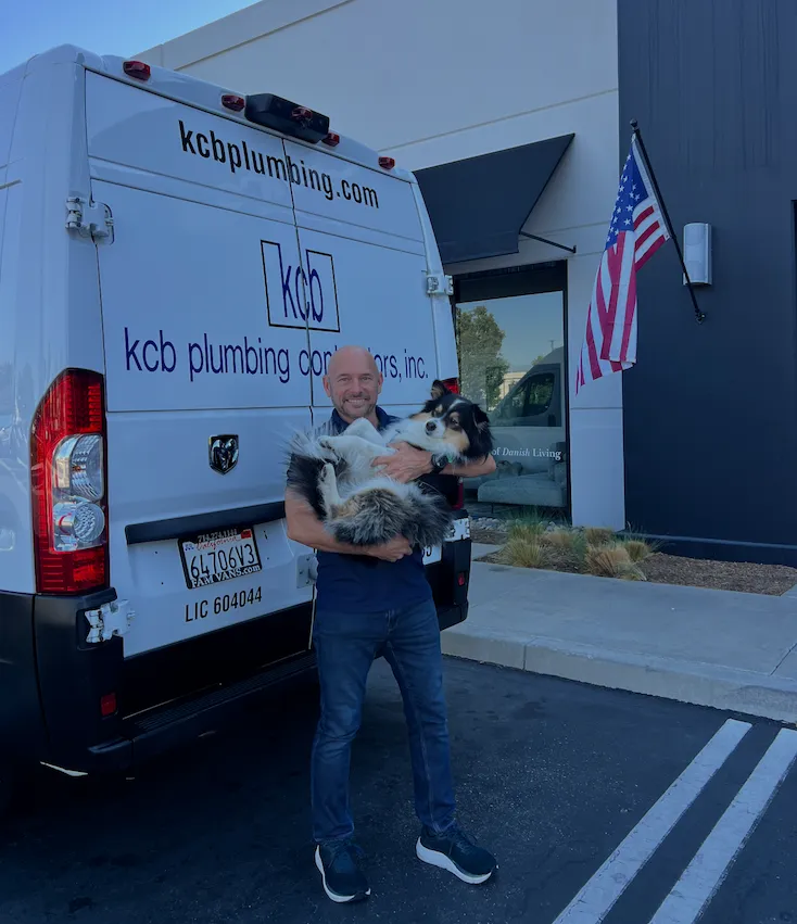 Keevin Blue, Founder of KCB Plumbing, with his dog