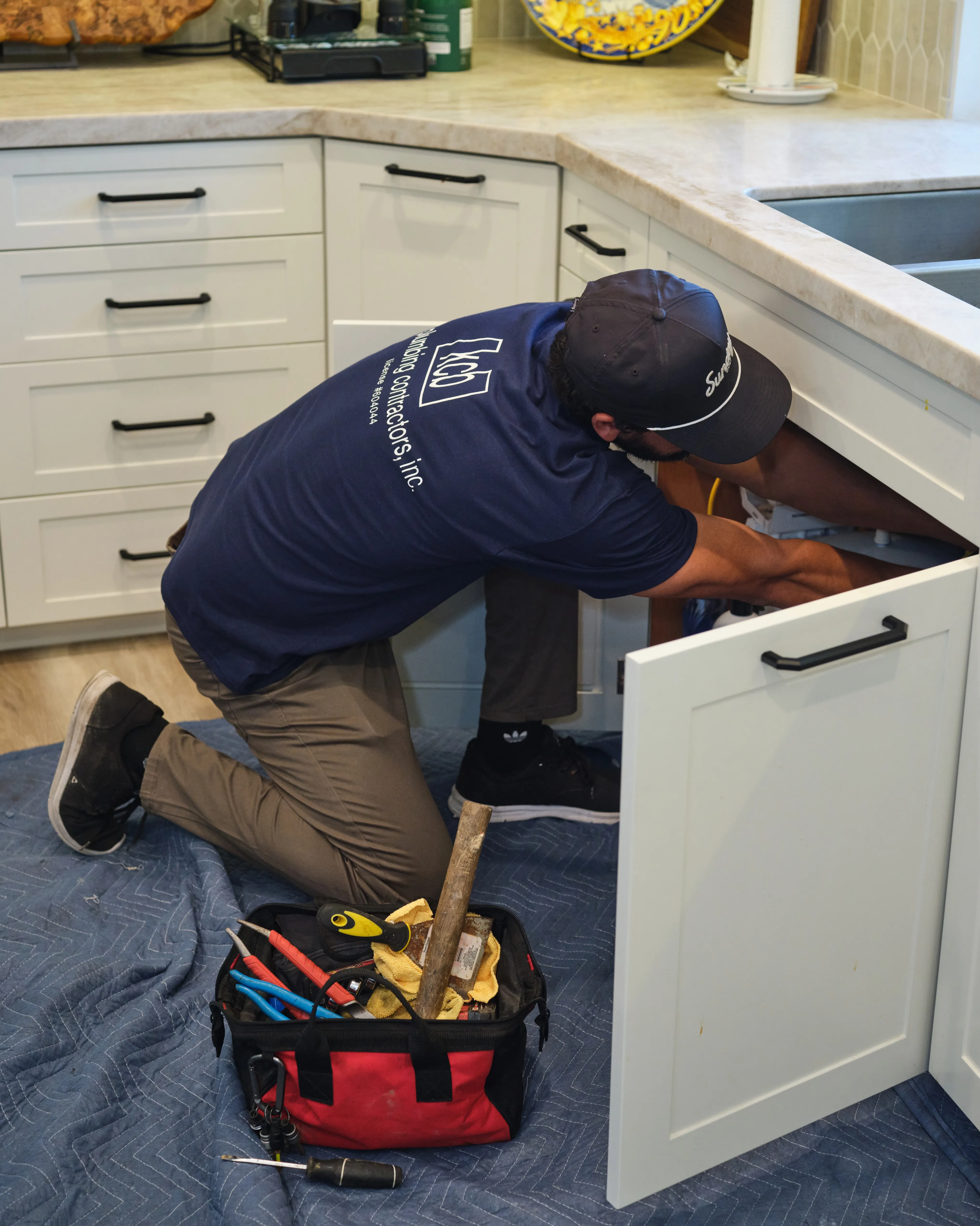 KCB Plumbing technician working on residential plumbing